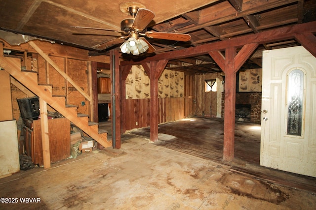 486 Mcintyre Way, Cogan Station, PA 17728 - below grade area with stairway, a stone fireplace, and a ceiling fan