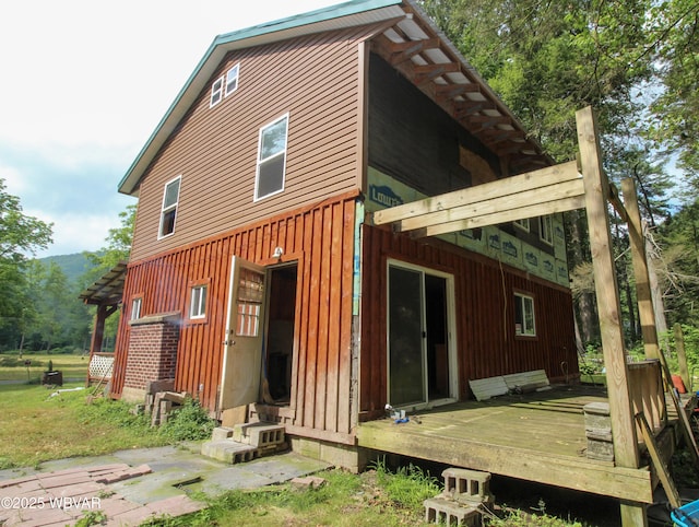 486 Mcintyre Way, Cogan Station, PA 17728 - back of house featuring a wooden deck and board and batten siding