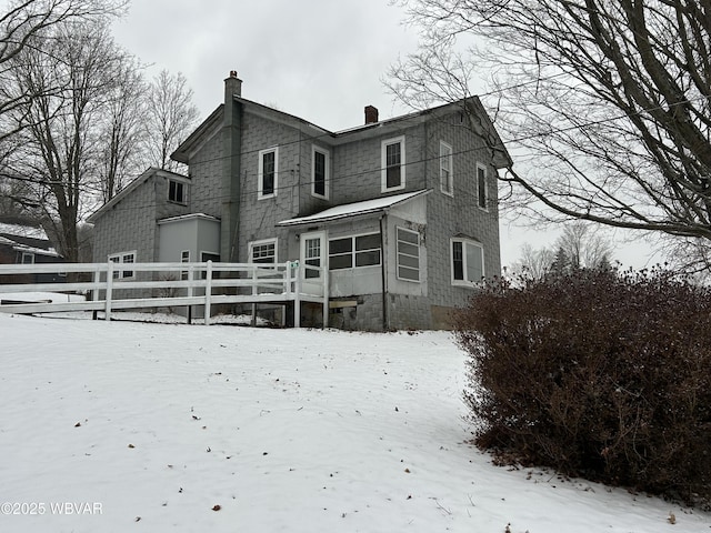 view of snow covered property