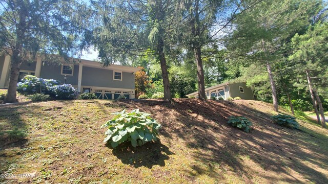 view of yard featuring a garage