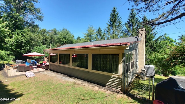 back of property featuring a patio area