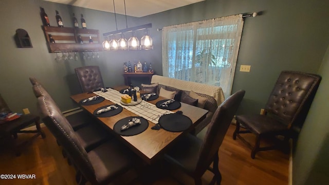 dining area with hardwood / wood-style flooring