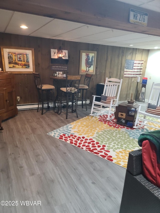 interior space with hardwood / wood-style floors and a baseboard heating unit