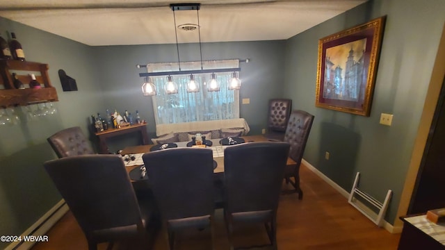 dining room with hardwood / wood-style flooring