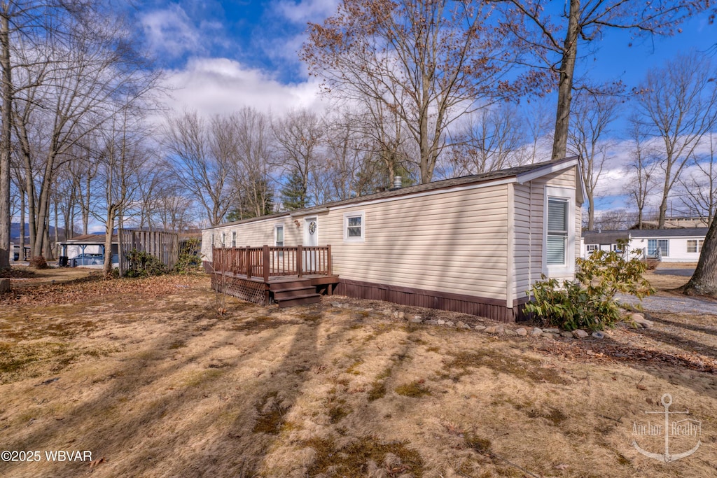 rear view of property with a deck