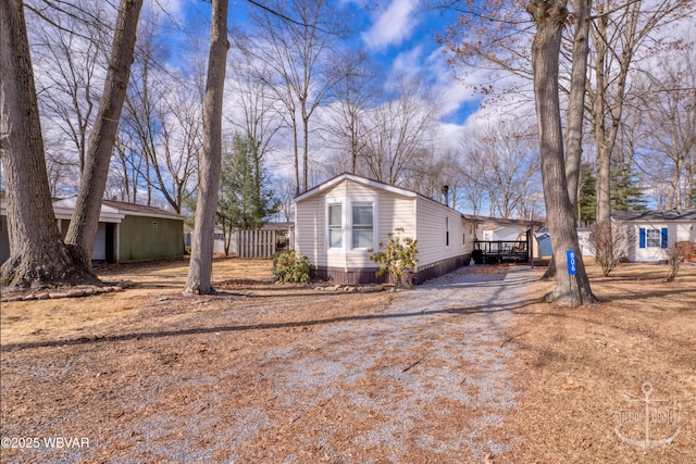 view of front of home featuring fence