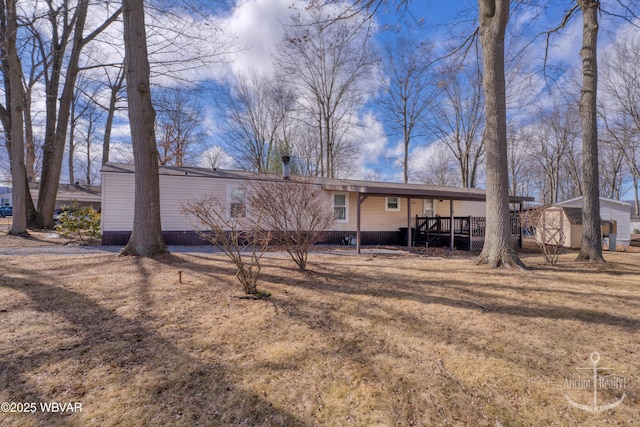 back of property featuring a deck