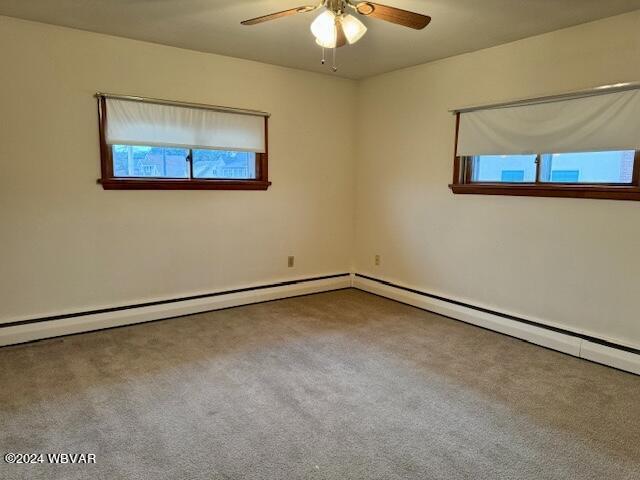 carpeted empty room with ceiling fan