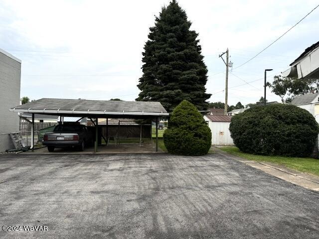 exterior space featuring a carport