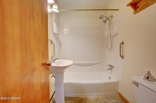 bathroom with toilet and shower / washtub combination