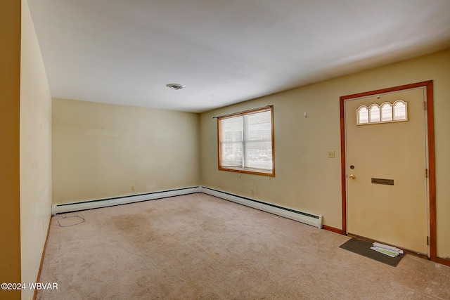 carpeted foyer entrance with a baseboard radiator and visible vents