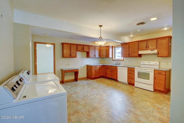 65 Spring St, Lock Haven, PA 17745 - kitchen featuring white appliances, separate washer and dryer, under cabinet range hood, hanging light fixtures, and recessed lighting