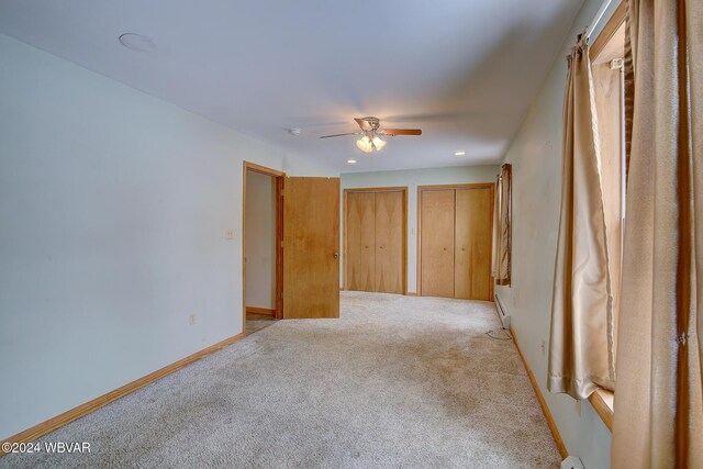 65 Spring St, Lock Haven, PA 17745 - unfurnished bedroom featuring multiple closets, light carpet, recessed lighting, a baseboard radiator, and ceiling fan