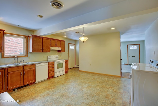 kitchen featuring white appliances, visible vents, light countertops, under cabinet range hood, and a sink