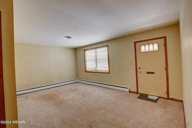 entryway featuring light colored carpet