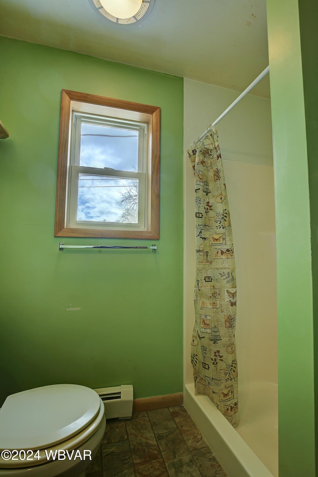 full bath with a baseboard radiator, a shower stall, toilet, and baseboards