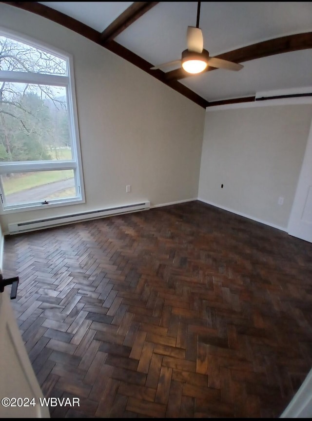 empty room with dark parquet floors and a baseboard heating unit