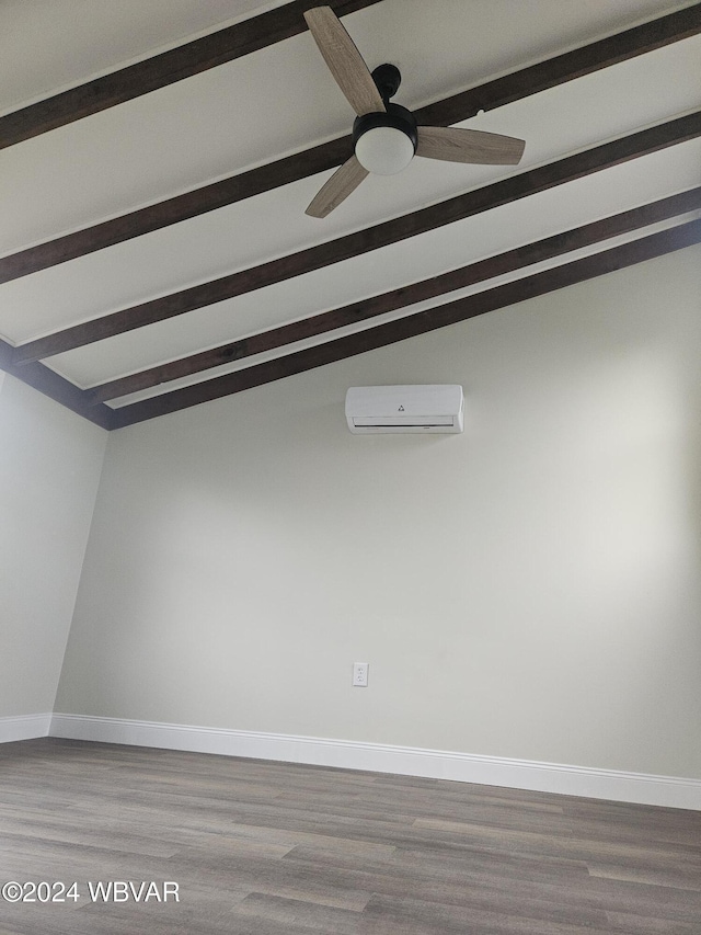 unfurnished room with hardwood / wood-style flooring, vaulted ceiling with beams, ceiling fan, and a wall mounted air conditioner