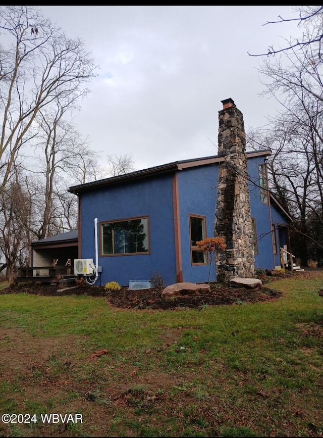 view of home's exterior with a lawn