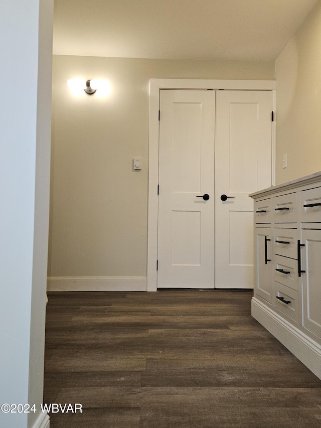 hall with dark hardwood / wood-style flooring