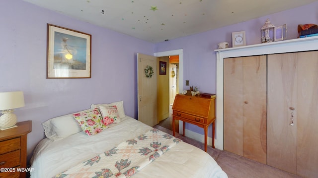 bedroom with a closet and carpet