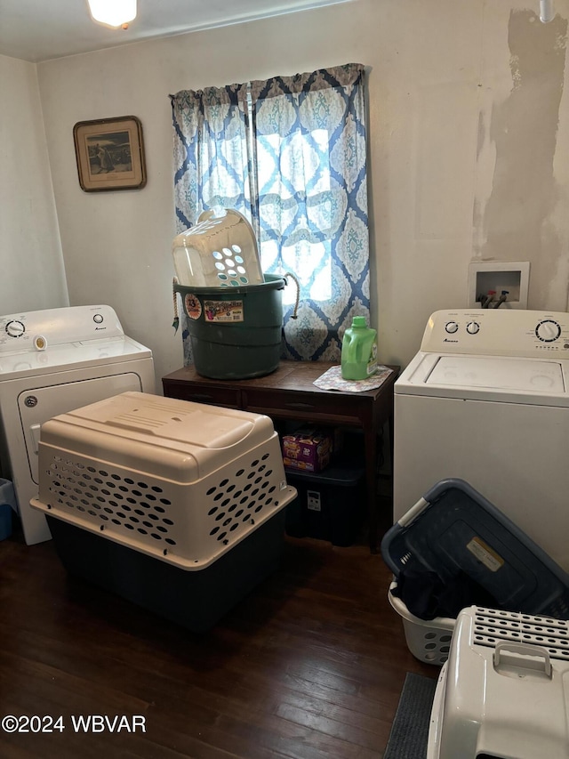 washroom with washing machine and dryer and dark wood-type flooring