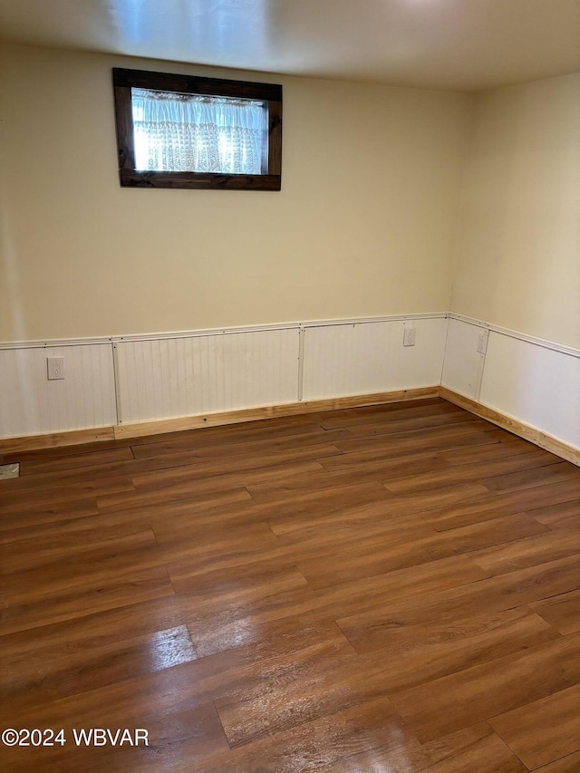 unfurnished room with dark hardwood / wood-style floors