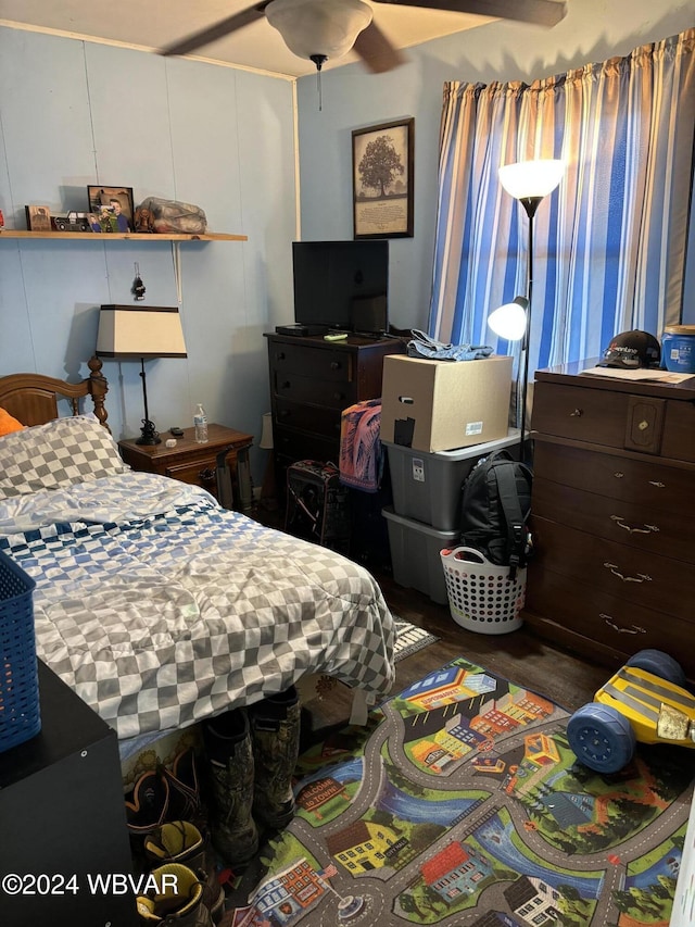 bedroom featuring ceiling fan and dark wood-type flooring