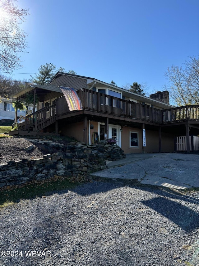 view of front of property with a wooden deck