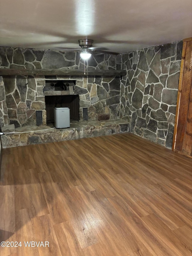 basement with hardwood / wood-style flooring