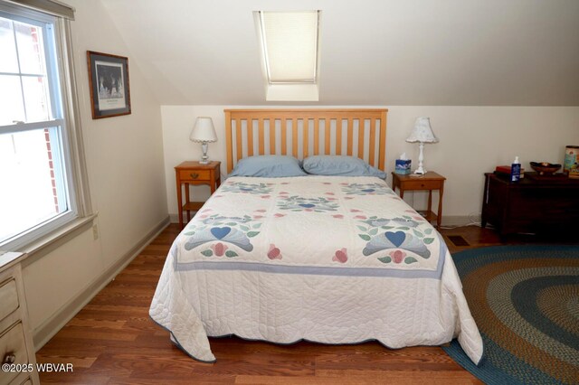 190 E Winter Rd, Loganton, PA 17747 - bedroom featuring wood finished floors, multiple windows, vaulted ceiling, and baseboards