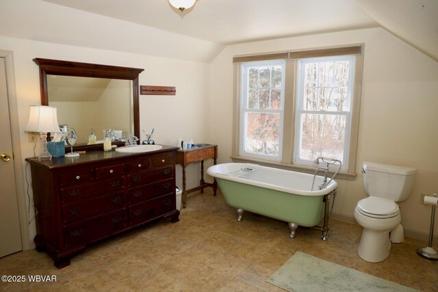 190 E Winter Rd, Loganton, PA 17747 - full bath with vaulted ceiling, a freestanding tub, vanity, and toilet
