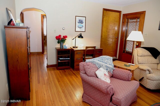 190 E Winter Rd, Loganton, PA 17747 - living room featuring light wood-style floors, baseboards, and arched walkways