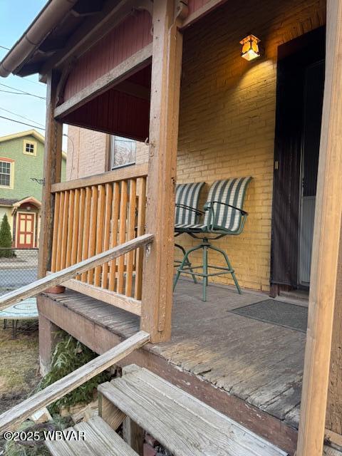 wooden deck with an outdoor structure