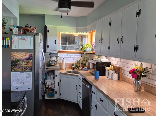 1520 Haagen Ln, Beech Creek, PA 16822 - kitchen with appliances with stainless steel finishes, light countertops, decorative backsplash, a ceiling fan, and dark wood-style floors