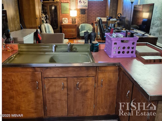 1520 Haagen Ln, Beech Creek, PA 16822 - kitchen with brown cabinets and brick wall