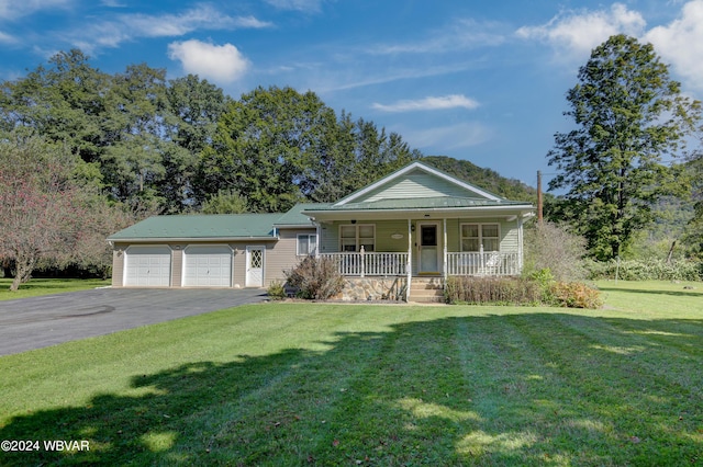 view of front facade with a porch, a garage, and a front yard