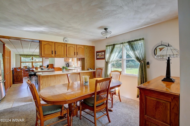 dining area with light carpet