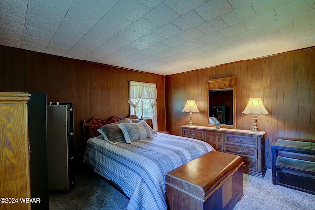 carpeted bedroom with wood walls