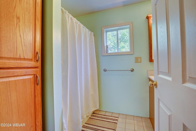 bathroom with tile patterned floors and vanity