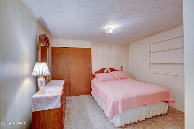 bedroom with light carpet