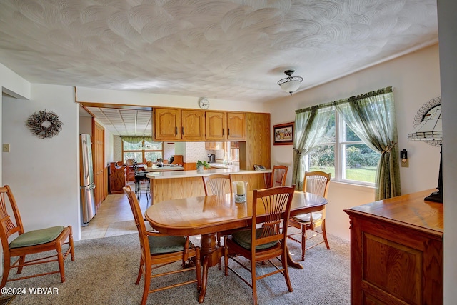 view of carpeted dining area