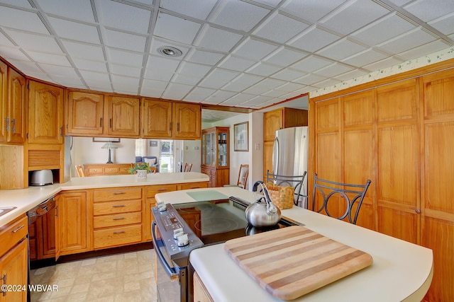 kitchen with kitchen peninsula and appliances with stainless steel finishes