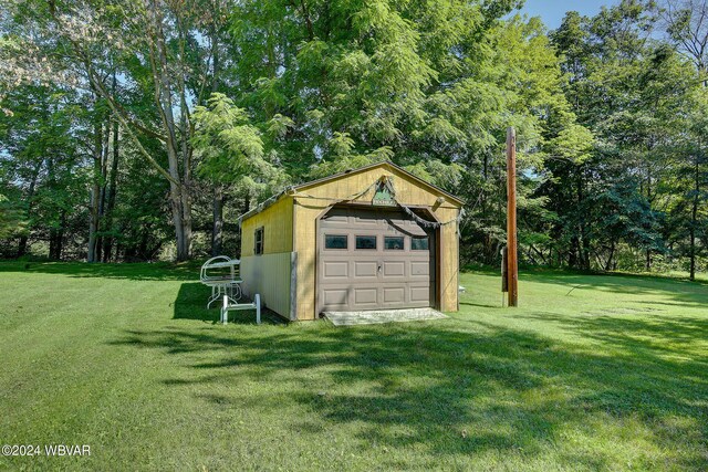 garage with a lawn