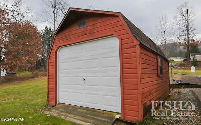 garage featuring a yard