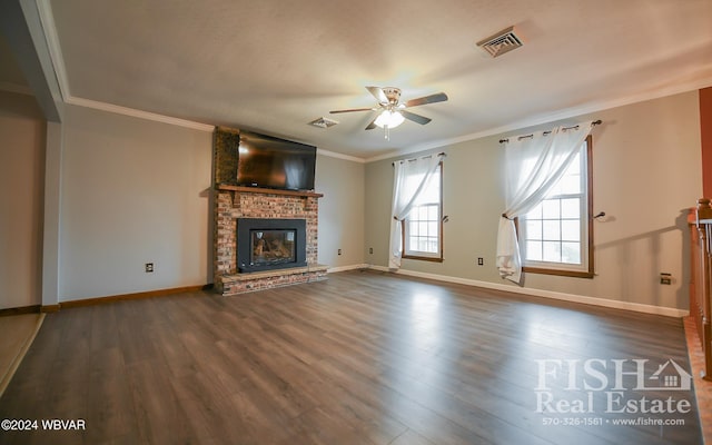 unfurnished living room featuring ceiling fan, a fireplace, hardwood / wood-style flooring, and ornamental molding