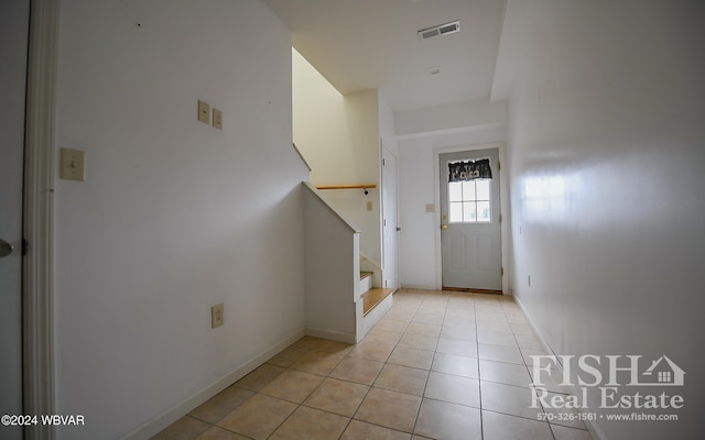 entryway featuring light tile patterned floors