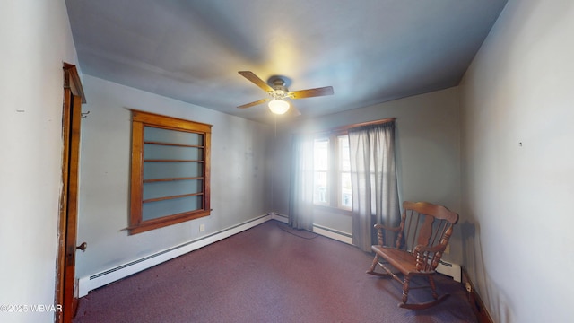 unfurnished room with a baseboard radiator, carpet floors, and ceiling fan