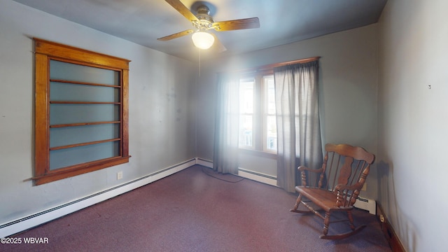 unfurnished room featuring ceiling fan, a baseboard radiator, and carpet floors