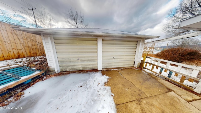 view of snow covered garage